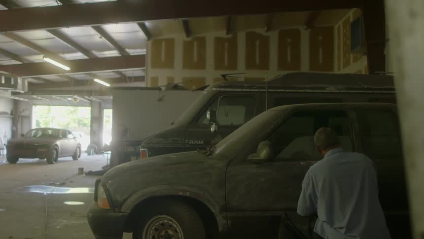 A man is washing his car