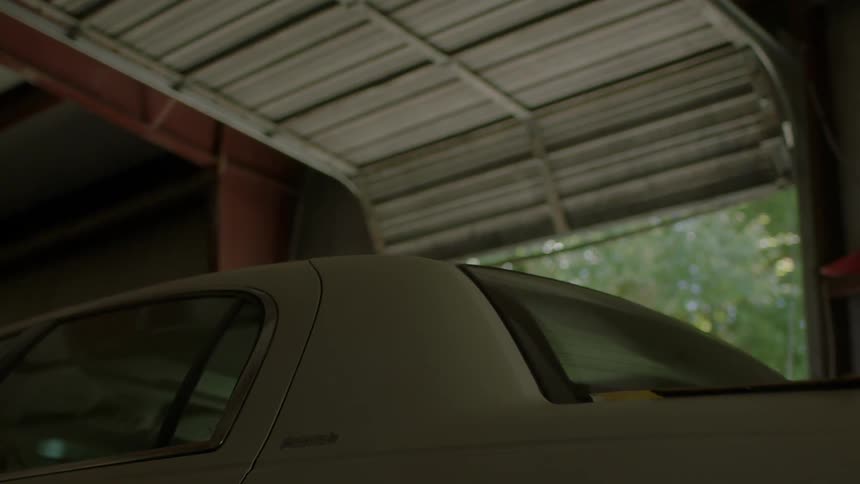 A car is parked in a garage