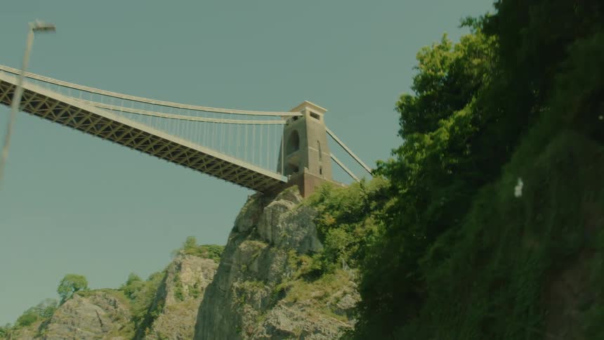 A bridge going over a road