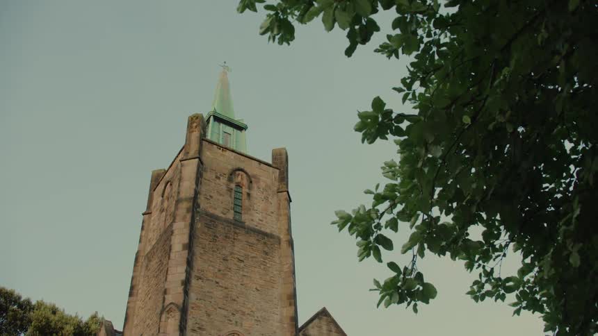 Tower with a cross on top of a steeple
