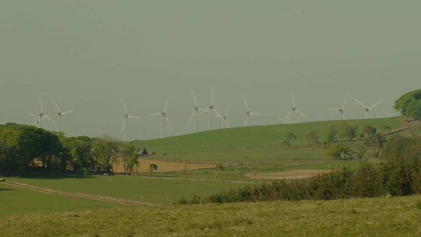 A view of some hills with windmills