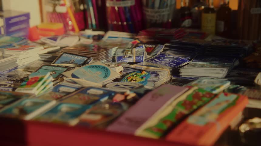 The table in the shop is covered with brochures