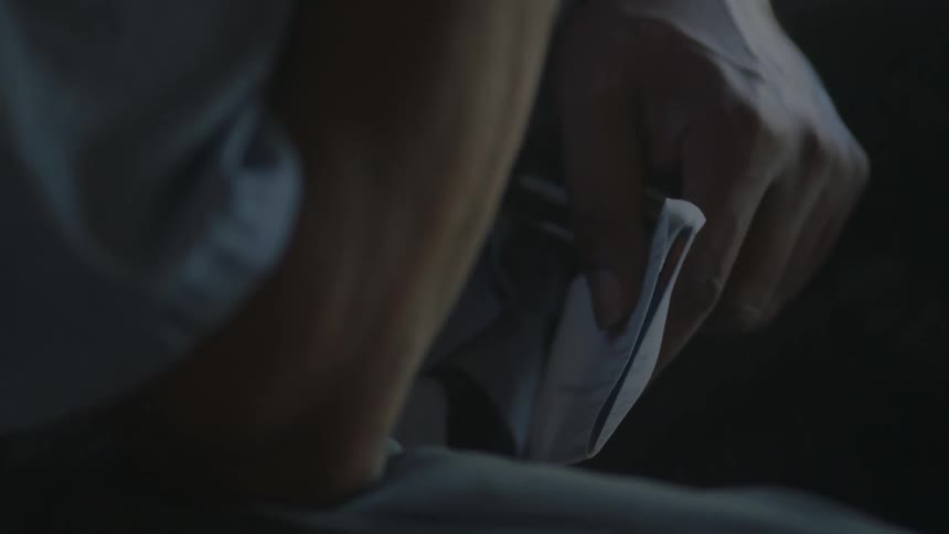 A person holds a letter in his hand