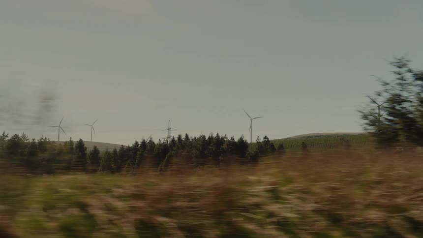 Windmills are ahead on the green field
