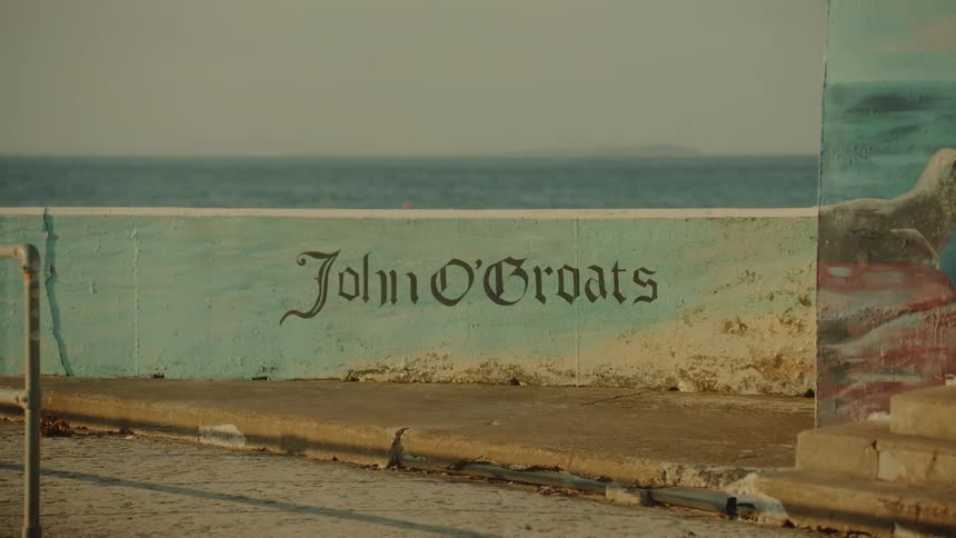 A persons name is written on the barrier of the harbor