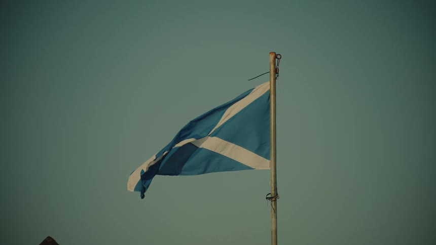 The scottish flag is blowing in the wind