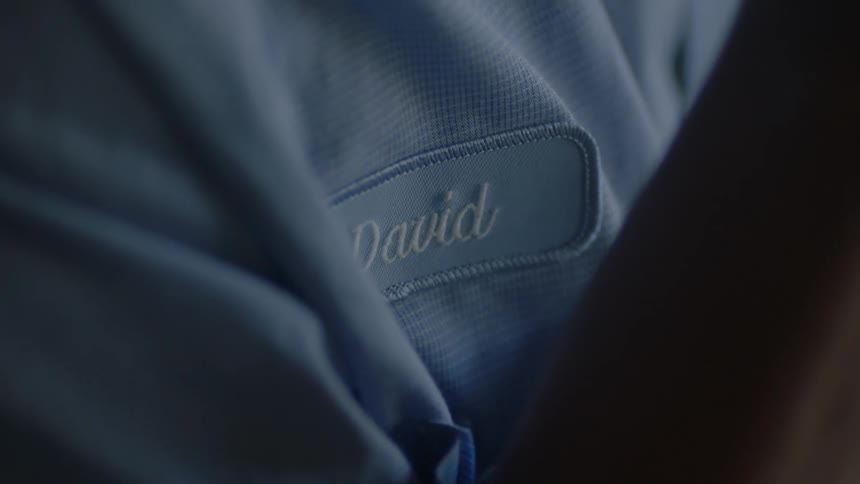Someone wearing a shirt with a name tag