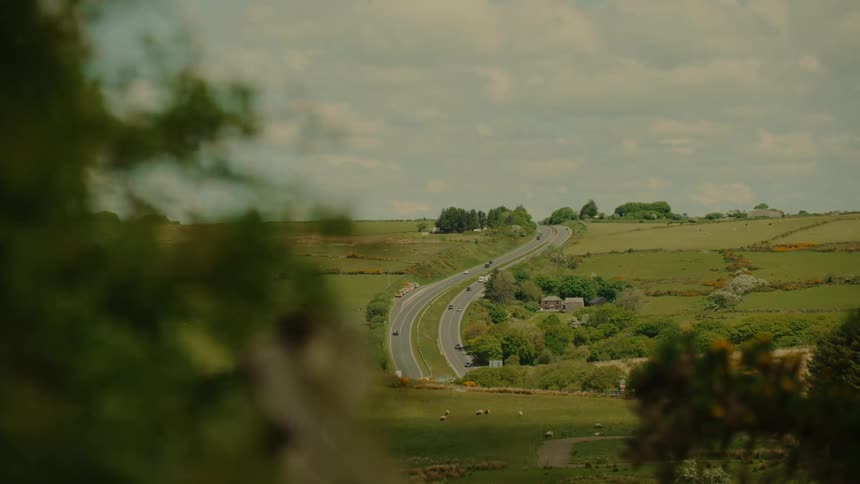 Traffic moves in both directions on highways through a rural neighborhood
