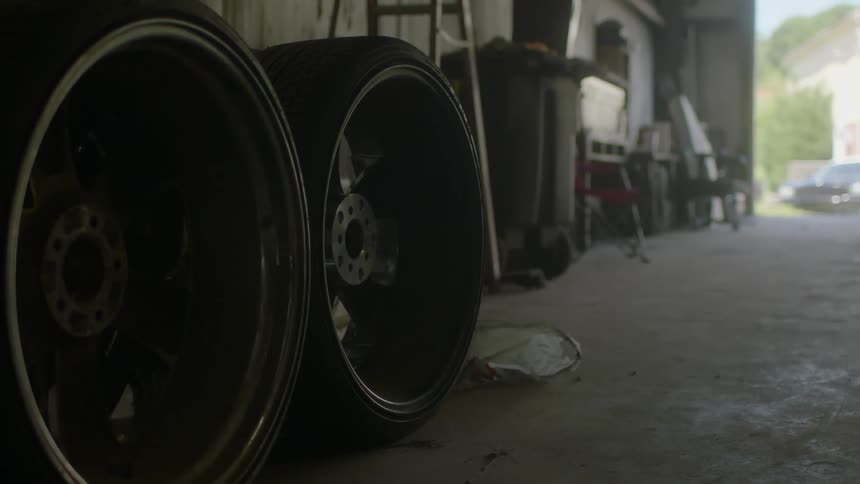 Close up of barrels on the floor of a garage