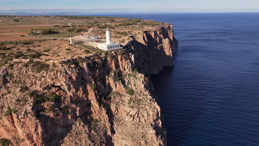 Lighthouse built on a rocky cliff by the sea