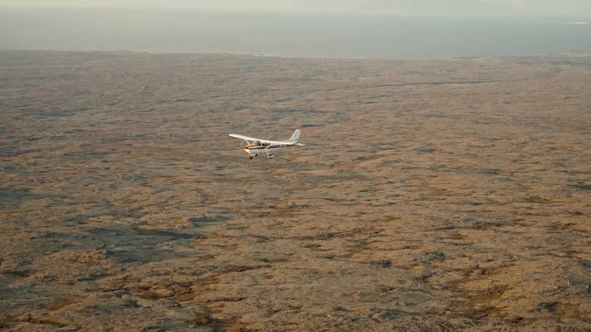 An aerial view of a plane flying