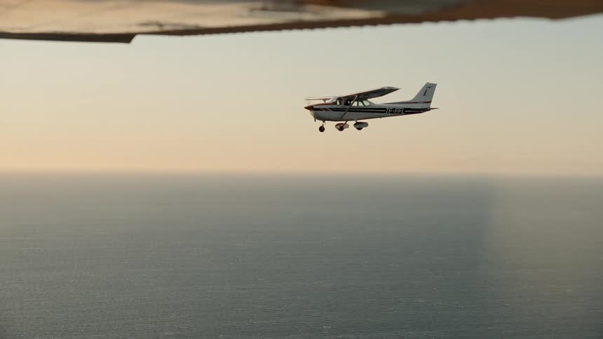 Singleengine plane flying over the sea