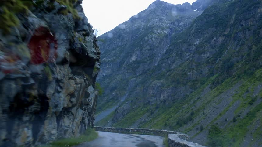 View driving through a tunnel on a mountainside