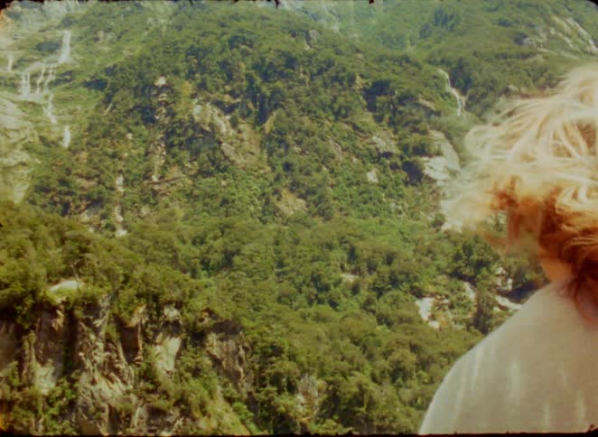 A woman looking at a mountain range