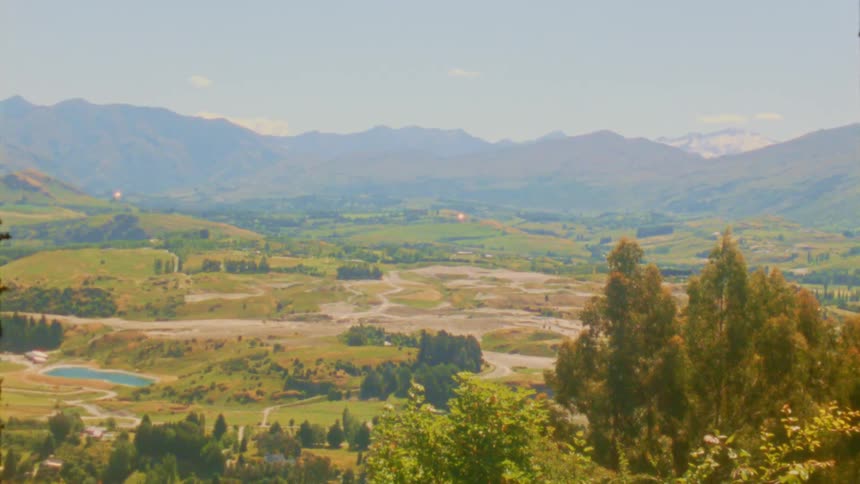 A view of a landscape with mountains in the distance
