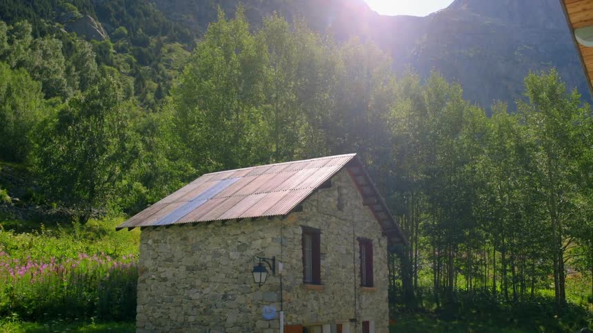 An abandoned cabin at the bottom of the mountains