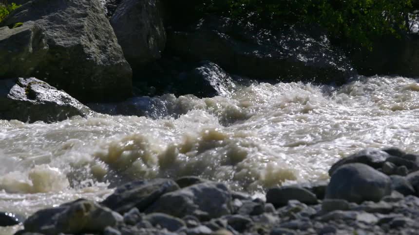River water crashes over rocks
