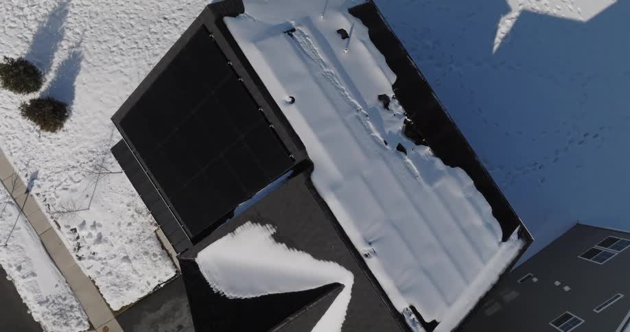 View from above of a house covered in snow
