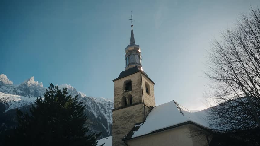 Steeple with a cross on the church bell tower