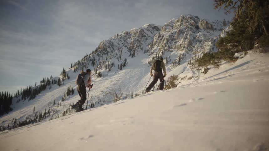 Two people cross country skiing