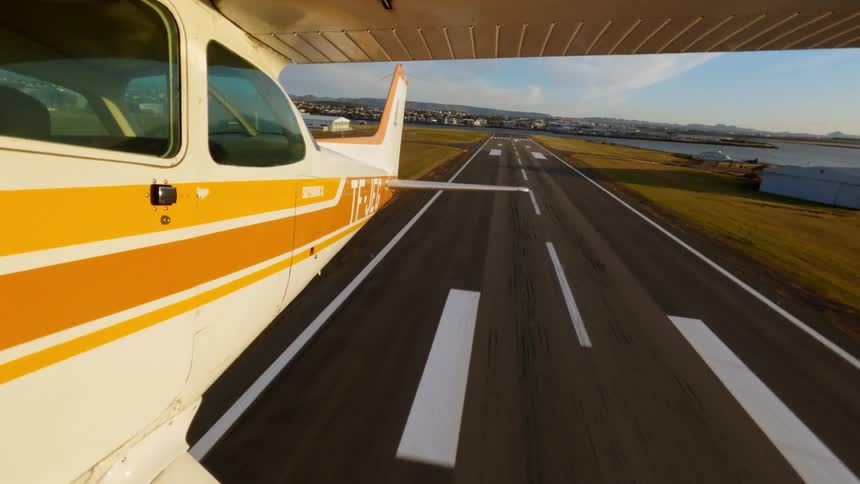 Singleengine aircraft taxiing on runway for takeoff