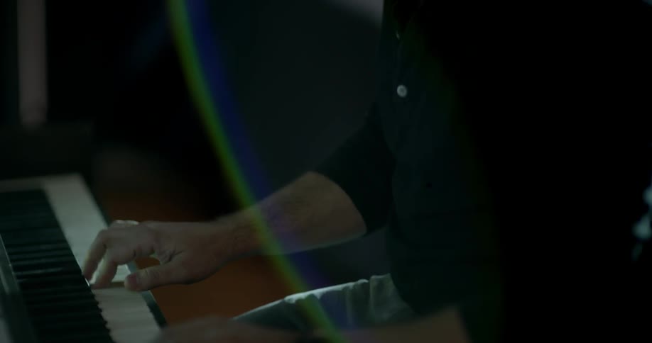 A man plays piano