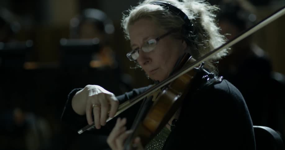 A woman plays a violin