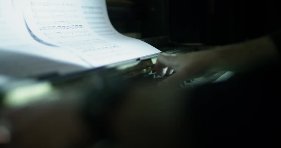 A man plays piano