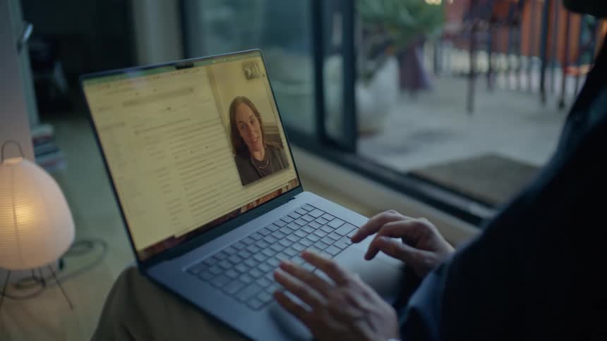 Two women talking via video chat on a laptop