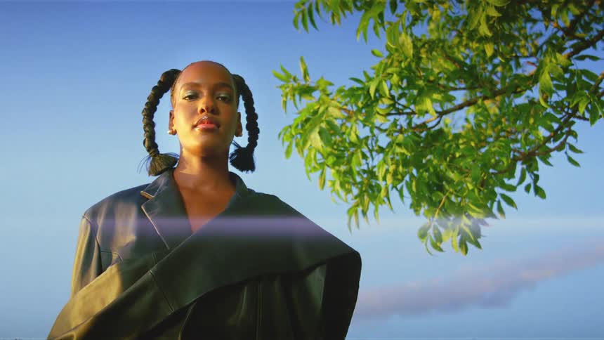 A portrait of a woman standing outdoors
