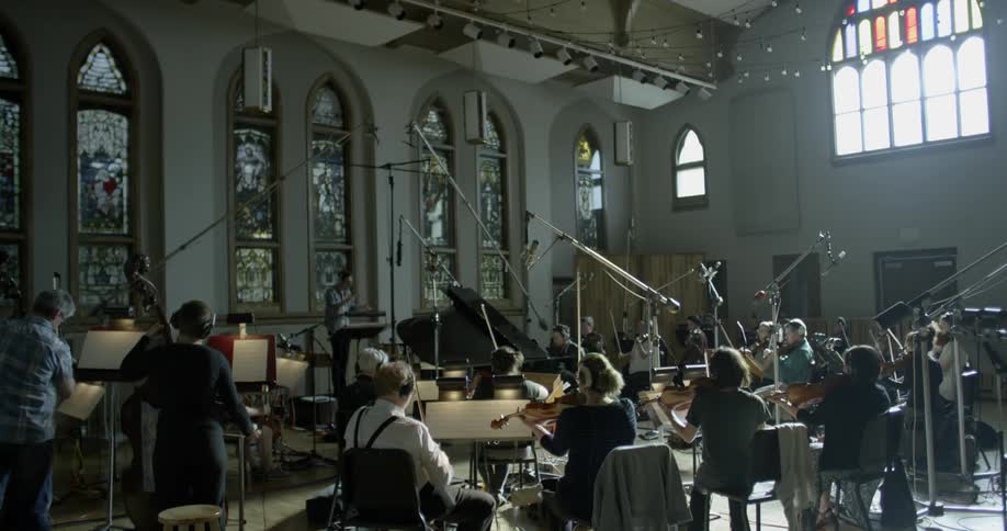 An orchestra performs in a church