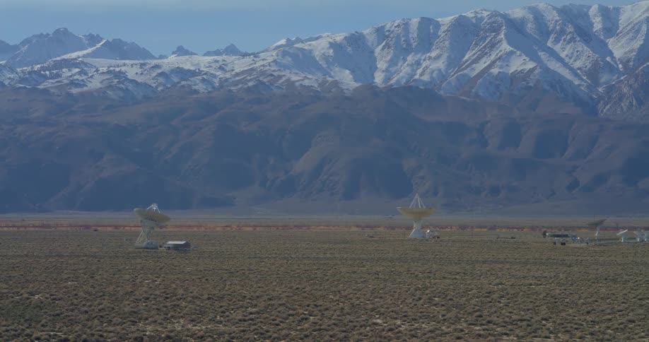 Large satellite dishes are by the mountain