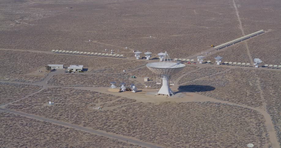 Radio telescope antenna dishes in the desert