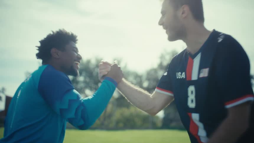 Goalkeeper and player shaking hands