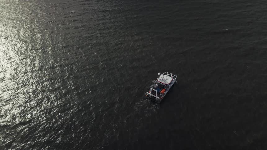 An aerial view of a boat in a lake