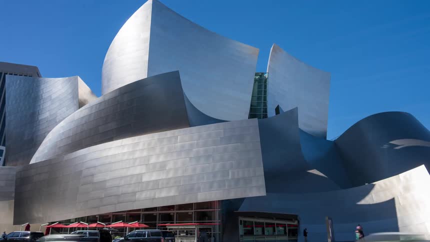 A busy Los Angelesat midday featuring Walt Disney Concert Hall  amidst the urban environment