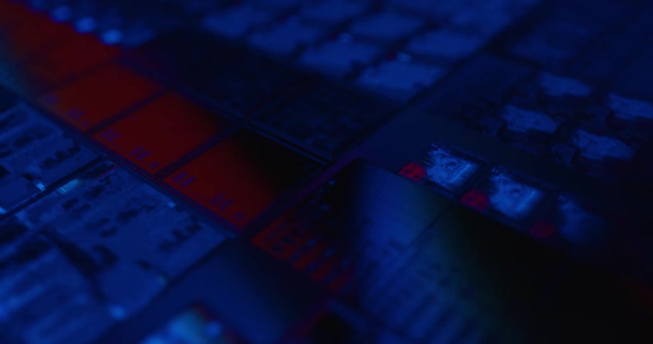 Microchip with modules and electronic traces illuminated in blue with a red stripe