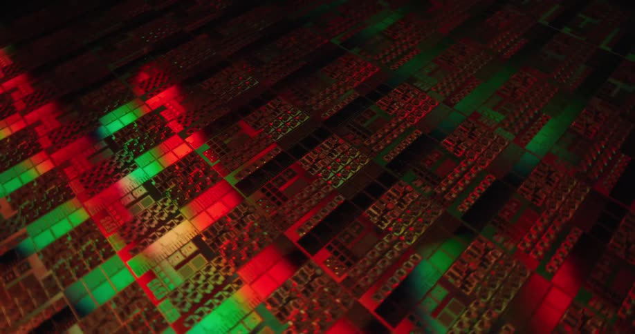 Light shined on the reflective surface of a circuit board is green and red