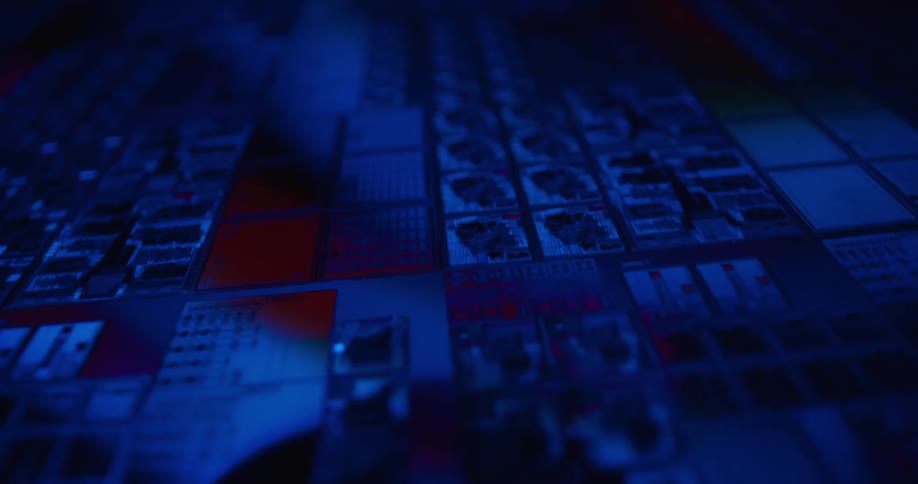 Microchip with modules and electronic traces under intense blue lighting