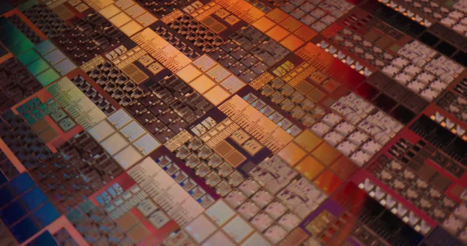 The reflective surface of a circuit board appears green and red