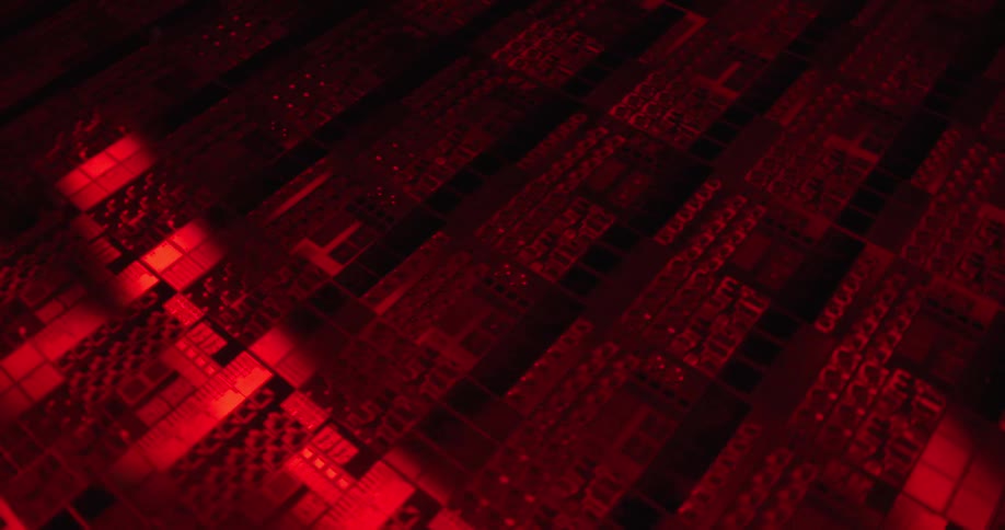 A detailed macro view of a semiconductor wafer or circuit board illuminated by a sweeping red light the rhythmic movement of the light across the complex gridlike patterns creates a hightech futuristic aesthetic