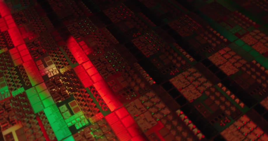 Microchip surface with circuits and electronic blocks illuminated in green and red
