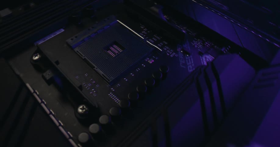 Colored lighting shines onto the interior of a computer