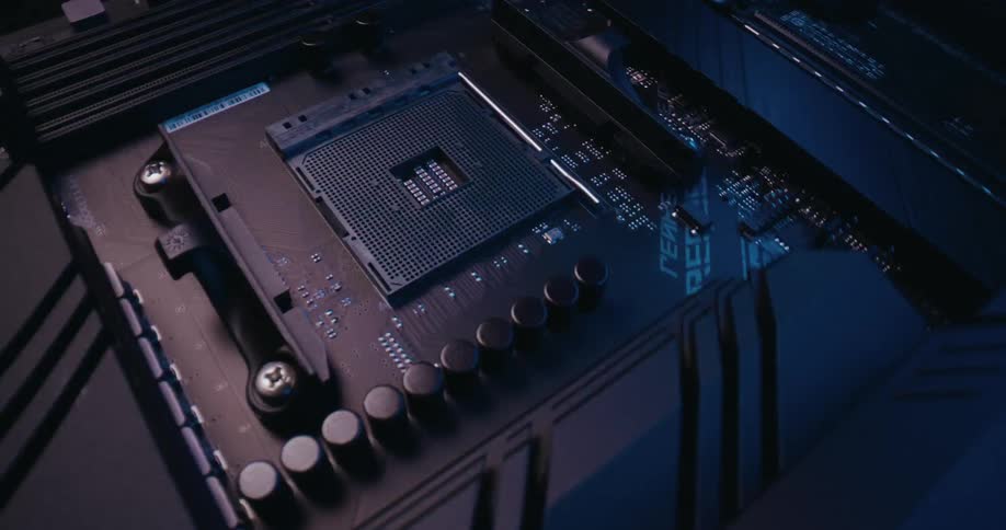 Close up of motherboard cpu socket illuminated by changing rgb lighting