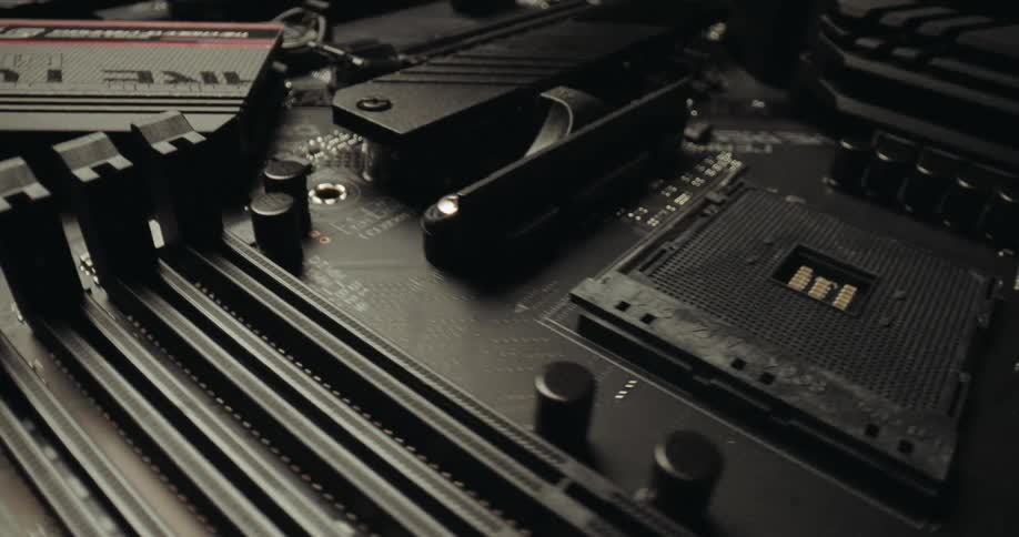 Computer motherboard with processor socket heatsink and memory slots
