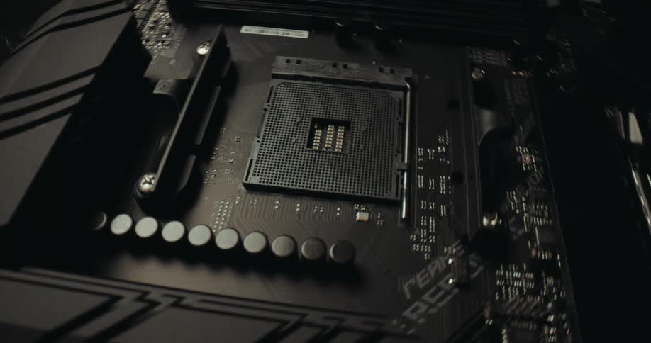 Processor socket on a motherboard with aligned capacitors and adjacent memory slots