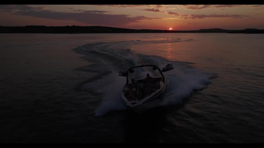 A view of a boat on the water at sunset