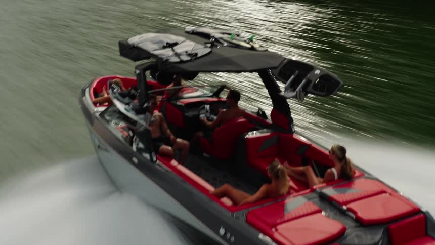 A group of friends enjoys a fast motorboat ride on water