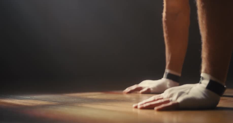 A man doing pushups in a room