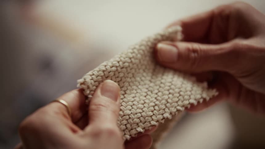 A woman holding some fabric